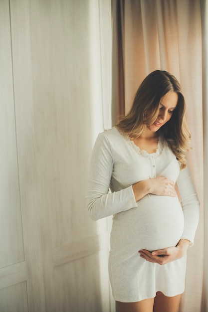 Portrait of the young pregnant woman