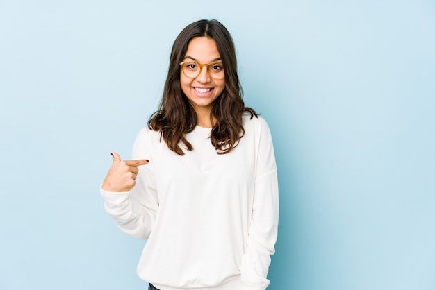 Portrait of a young pretty woman pointing her