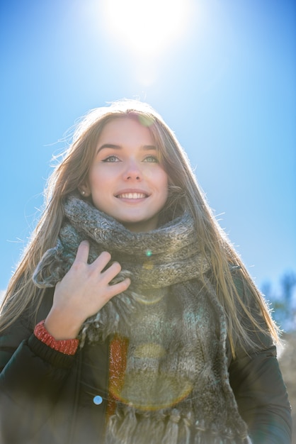 Portrait Young pretty woman in winter in the snow