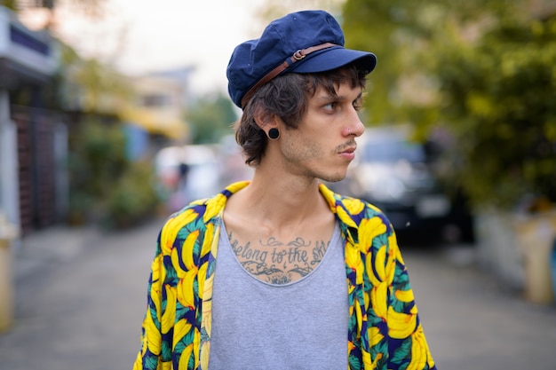 portrait of young rebellious man in the streets outdoors