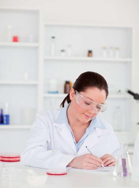 Portrait of a young scientist preparing a report