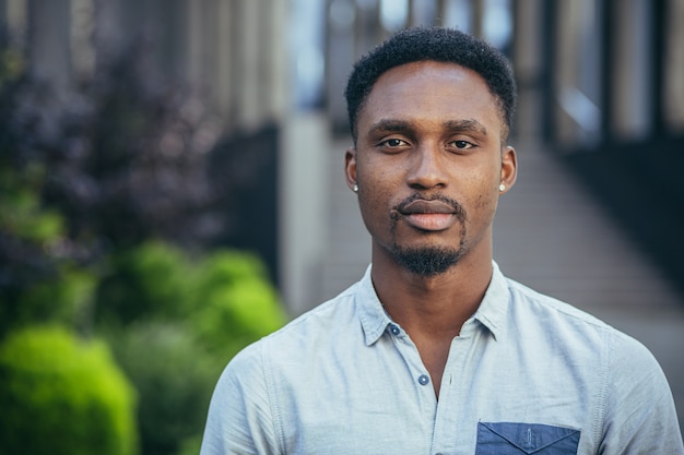 Portrait of a young serious african american man looking at the camera, serious