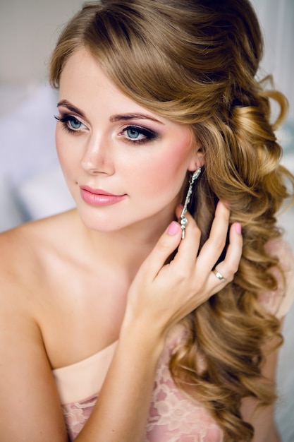 Portrait of young sexy girls blonde in a dress with make up