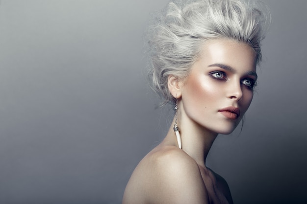 Portrait of a young silver-hair girl from a profile angle