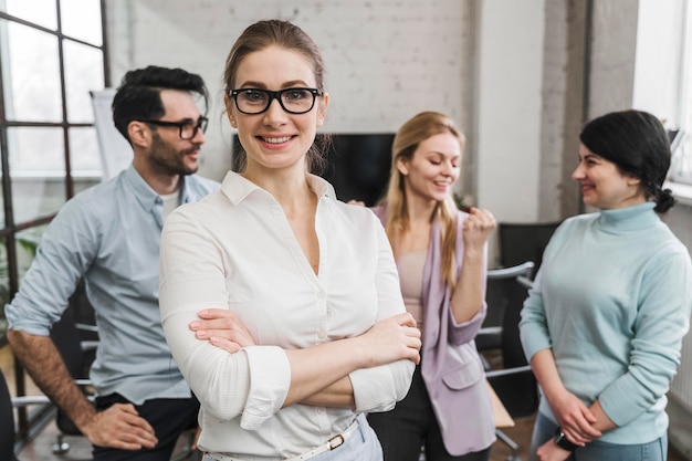 Portrait of young smiley businesspeople during a meeting