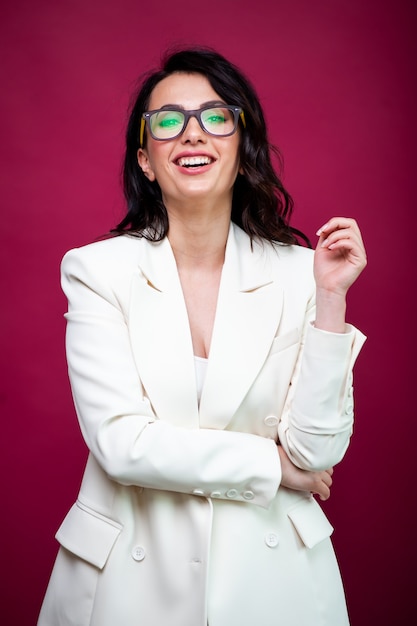 Portrait of young smiling businesswoman in eyewear  