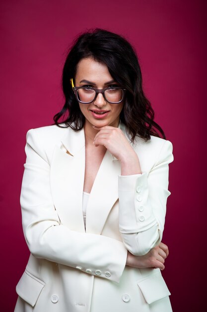 Portrait of young smiling businesswoman in eyewear  