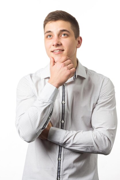 Portrait of young smiling caucasian man with crossed arms wearing smart watch and casual denim shirt isolated on white