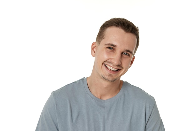 portrait of young smiling man on white