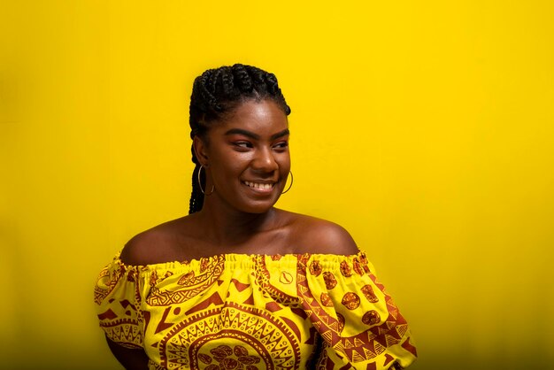 Portrait of young smiling pretty woman wearing long colorful clothes