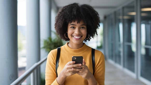 Portrait of young smiling woman holding smartphone turn head at copy space chatting cellular sta