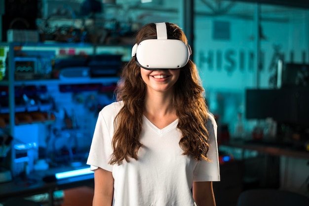 Portrait of a young smiling woman in VR glasses