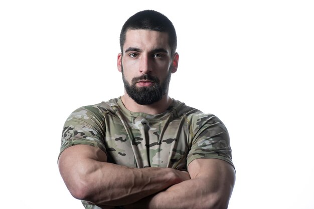 Portrait of Young Soldier Arms Crossed on a White Background