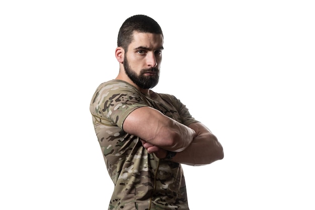 Portrait of Young Soldier Arms Crossed on a White Background