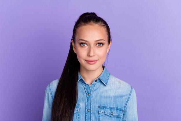 Portrait of young teenage girl looking at camera with serious pensive expression caucasian model posing