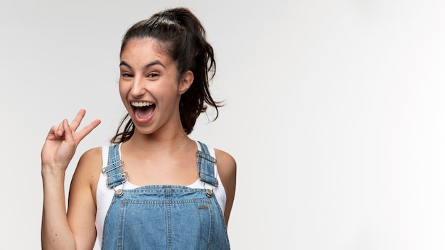 Portrait of young teenage girl in overalls