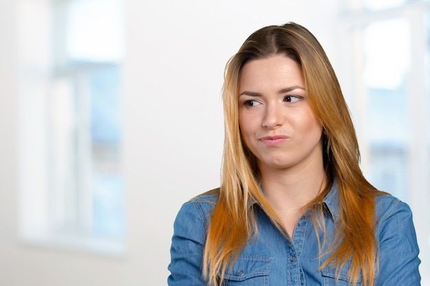 Portrait of the young thinking woman