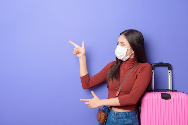 Portrait of young traveler woman with face mask , New normal travel concept