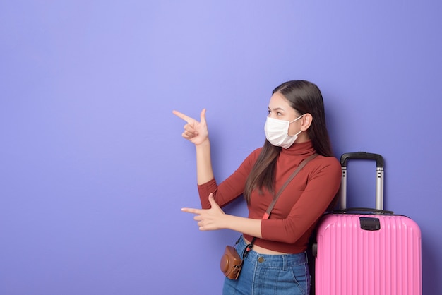 Portrait of young traveler woman with face mask