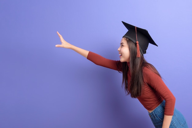 Portrait of young University student woman with graduation cap 