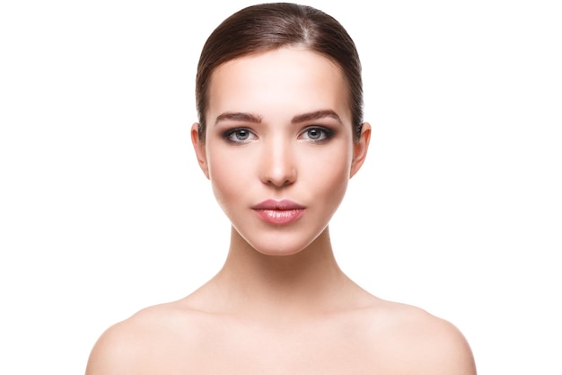 Portrait of young woman against white background