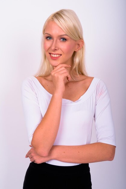 Portrait of a young woman against white background