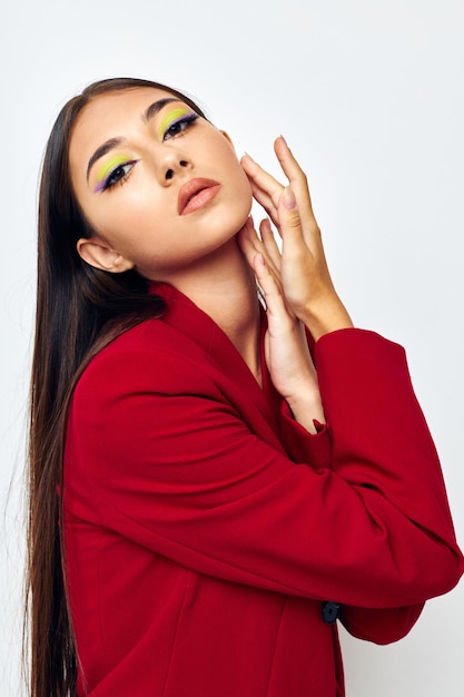 Portrait of young woman against white background