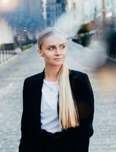 Portrait of a young woman on the background of the city