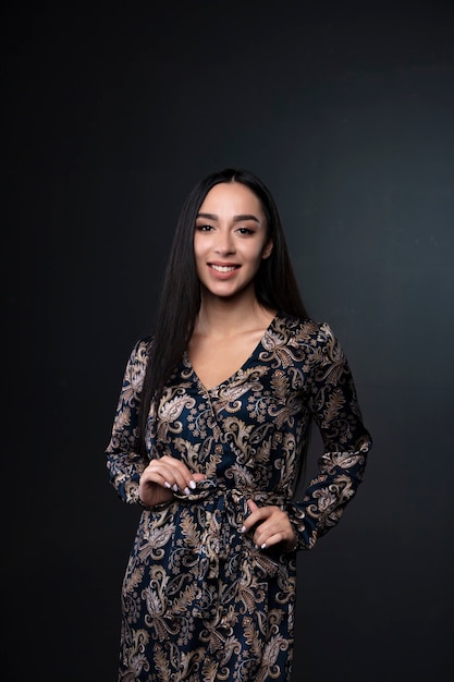 portrait of a young woman on black