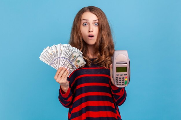 Portrait of young woman on blue background