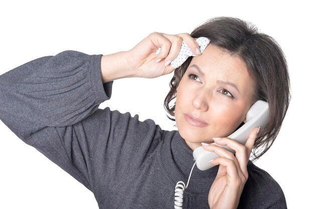 Photo portrait of young woman calling doctor on the phone isolated on white background