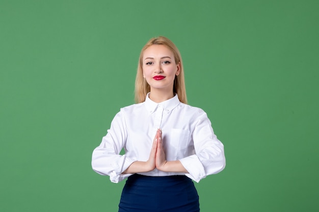 portrait of young woman in conservative clothing green wall lessons teacher study college school