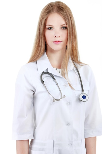 Portrait of young woman doctor with white coat standing in hospital