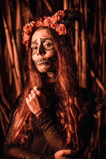 portrait of a young woman dressed as a Mexican skull