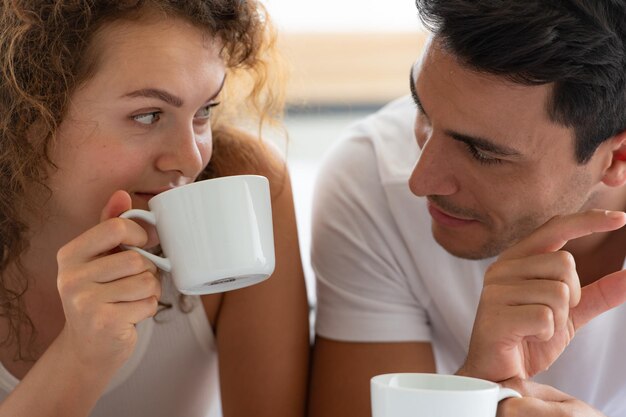 Portrait of young woman drinking coffee