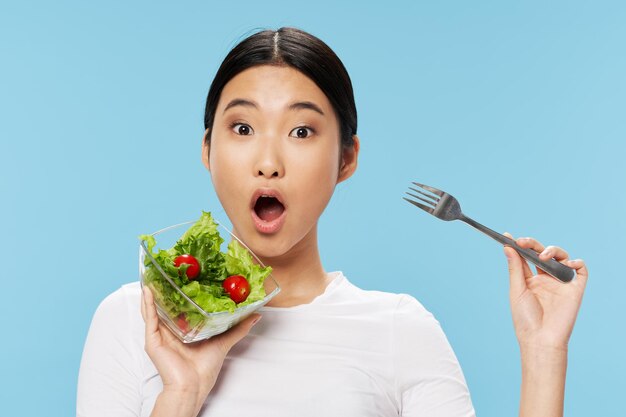 Portrait of young woman eating food