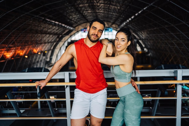 Portrait of young woman exercising in gym