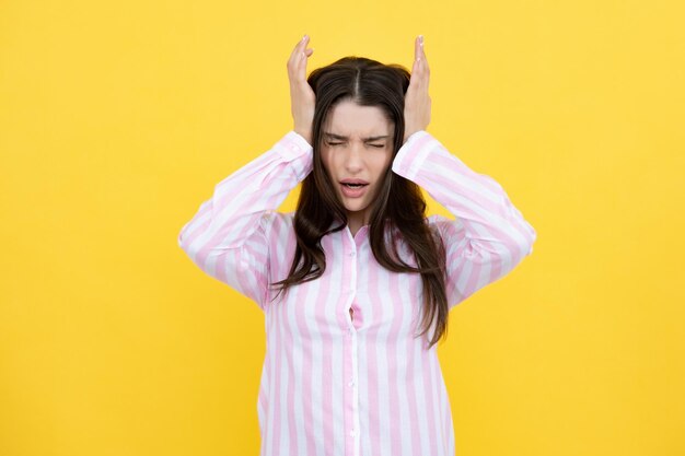 Portrait of young woman feeling stress or strain headache Exhausted tired girl desperate and stressed because pain and migraine Upset sad depressed model with hands on head