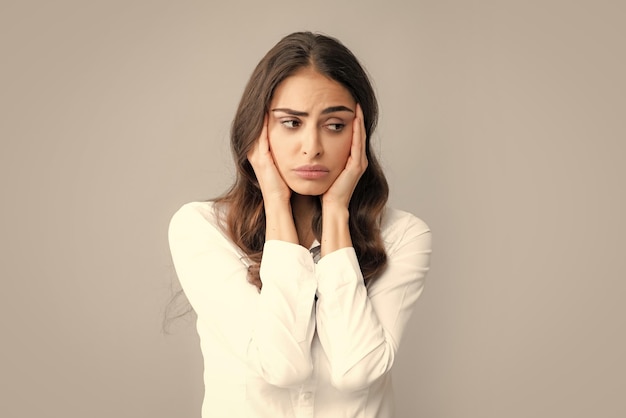 Portrait of young woman feeling stress or strain headache Exhausted tired girl desperate and stressed because pain and migraine Upset sad depressed model with hands on head