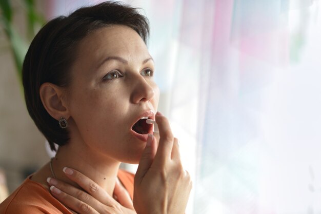 Portrait of a young woman feels sickness