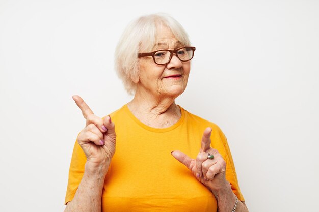 Portrait of young woman gesturing against white background