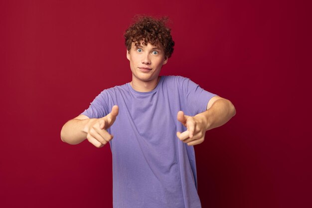 Portrait of young woman gesturing against yellow background