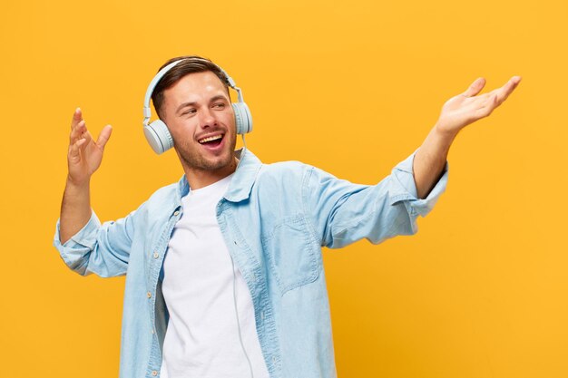 Portrait of young woman gesturing against yellow background