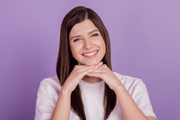 Portrait of young woman happy smile hands isolated over violet background