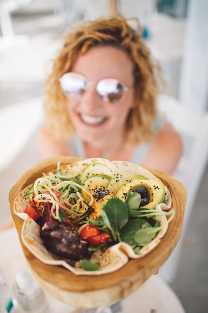 Portrait of young woman having food