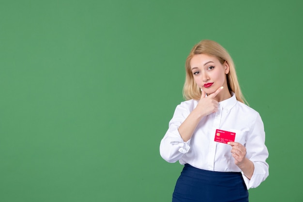 portrait of young woman holding credit card green wall business teacher money school