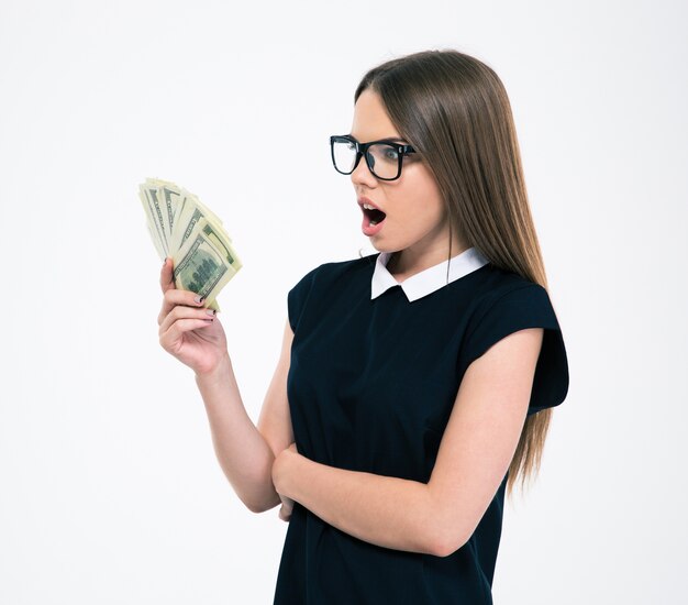Portrait of a young woman holding dollar bills isolated