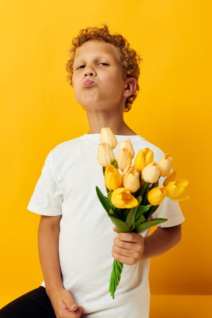 Portrait of young woman holding flowers