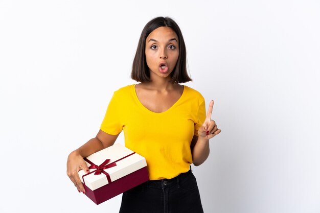 Portrait of a young woman holding a gift