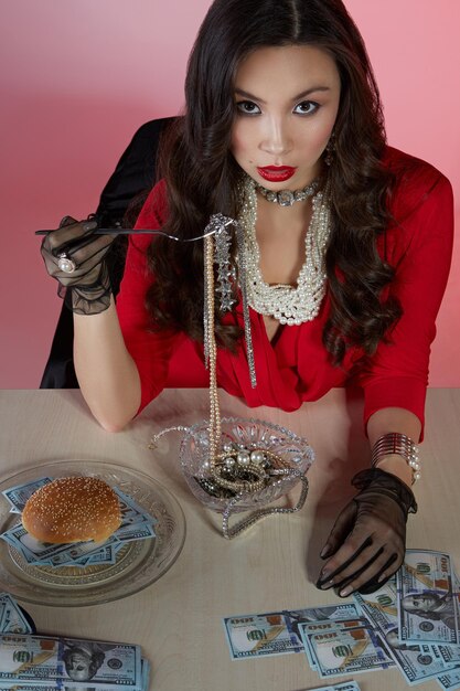 Portrait of young woman holding ice cream